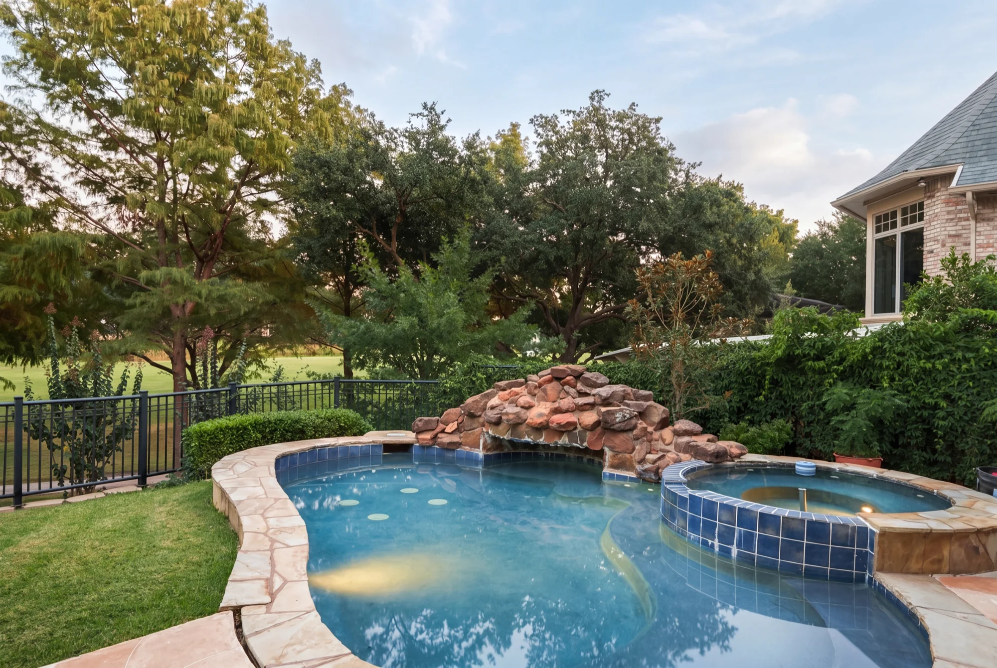 Heated pool with waterfall and spa